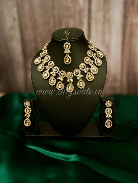 Jyeshtha Copper Gold Kundan Jewellery Set with Earrings and Mangtika